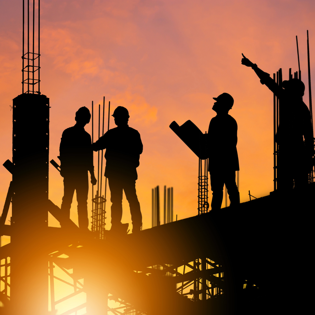 Construction team at sunset